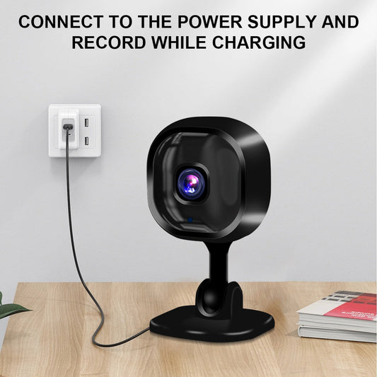 Black two-way intercom security camera charging and recording.