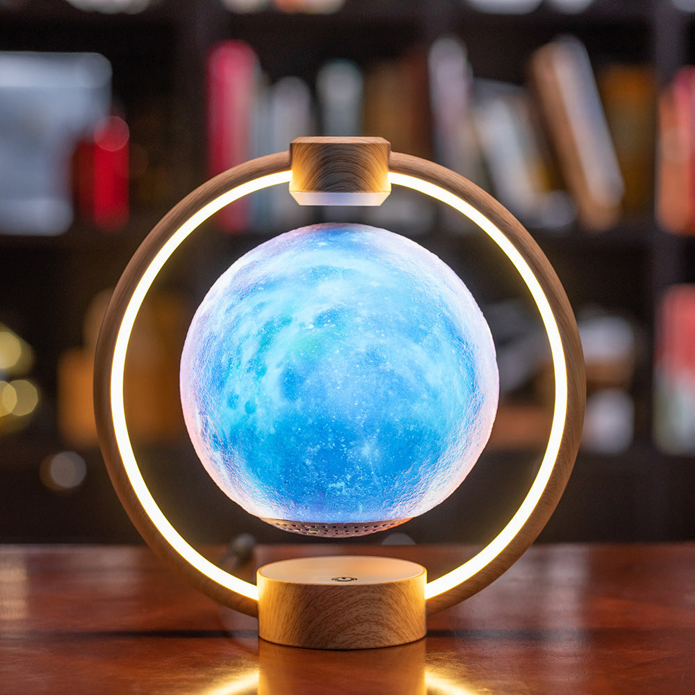 Maglev Moon Light Bluetooth speaker with colorful 3D glare and wooden base.