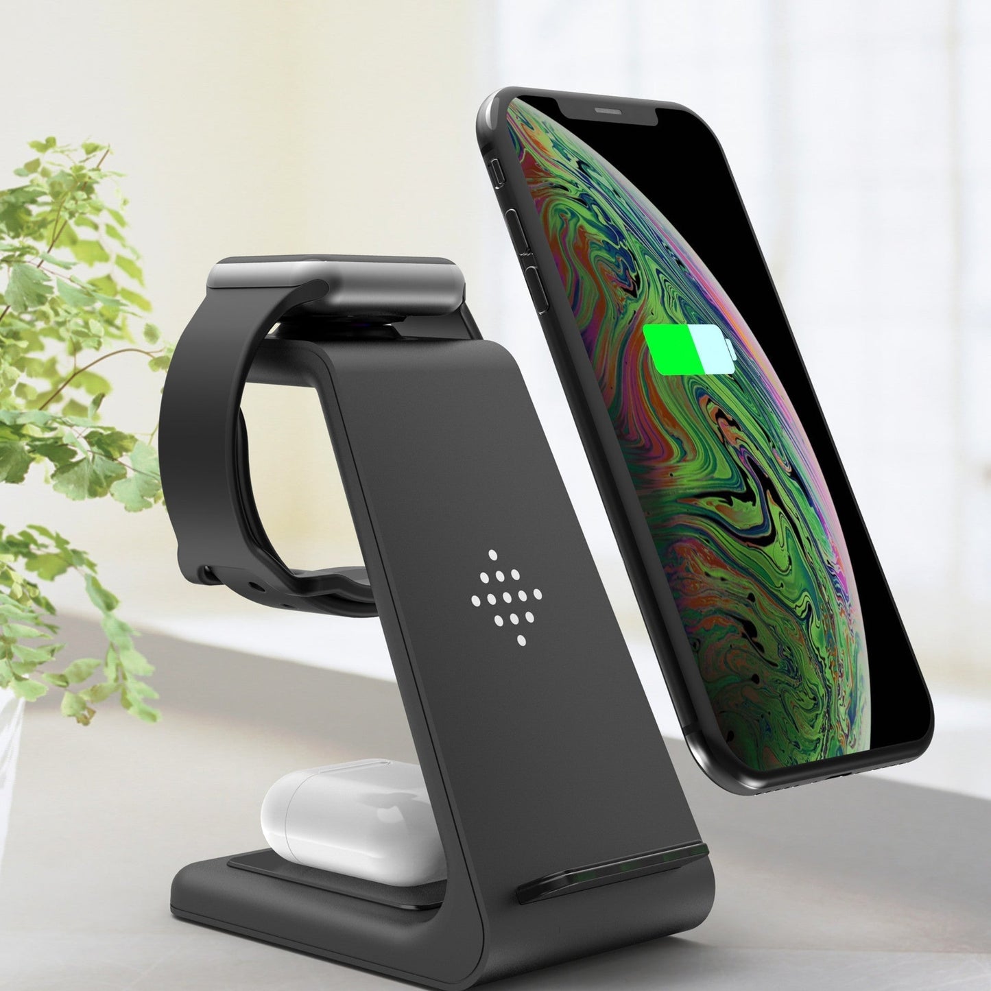 Multi-device charging dock with wireless charging for phone, watch, and earbuds.