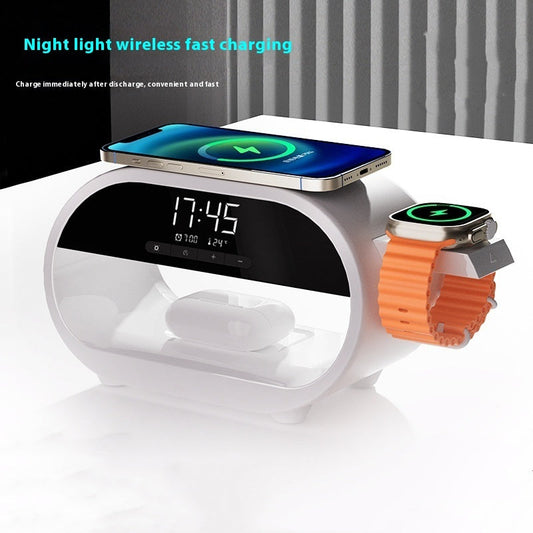 Night lamp alarm clock with wireless charger on bedside table.