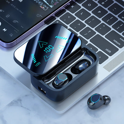 Bluetooth headset with long battery life, digital display, and charging case on a laptop keyboard.